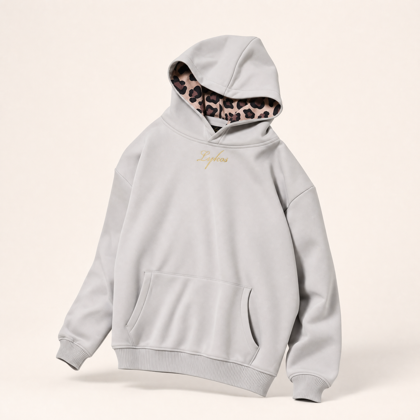 Origin Hoodie Grey on a ghost mannequin, three-quarter angle showing the leopard hood lining