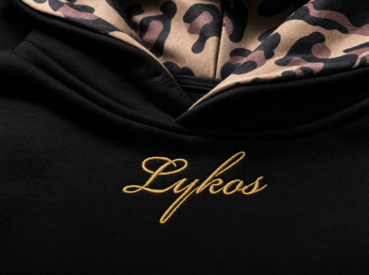 Gold Lykos embroidery macro with leopard lining
