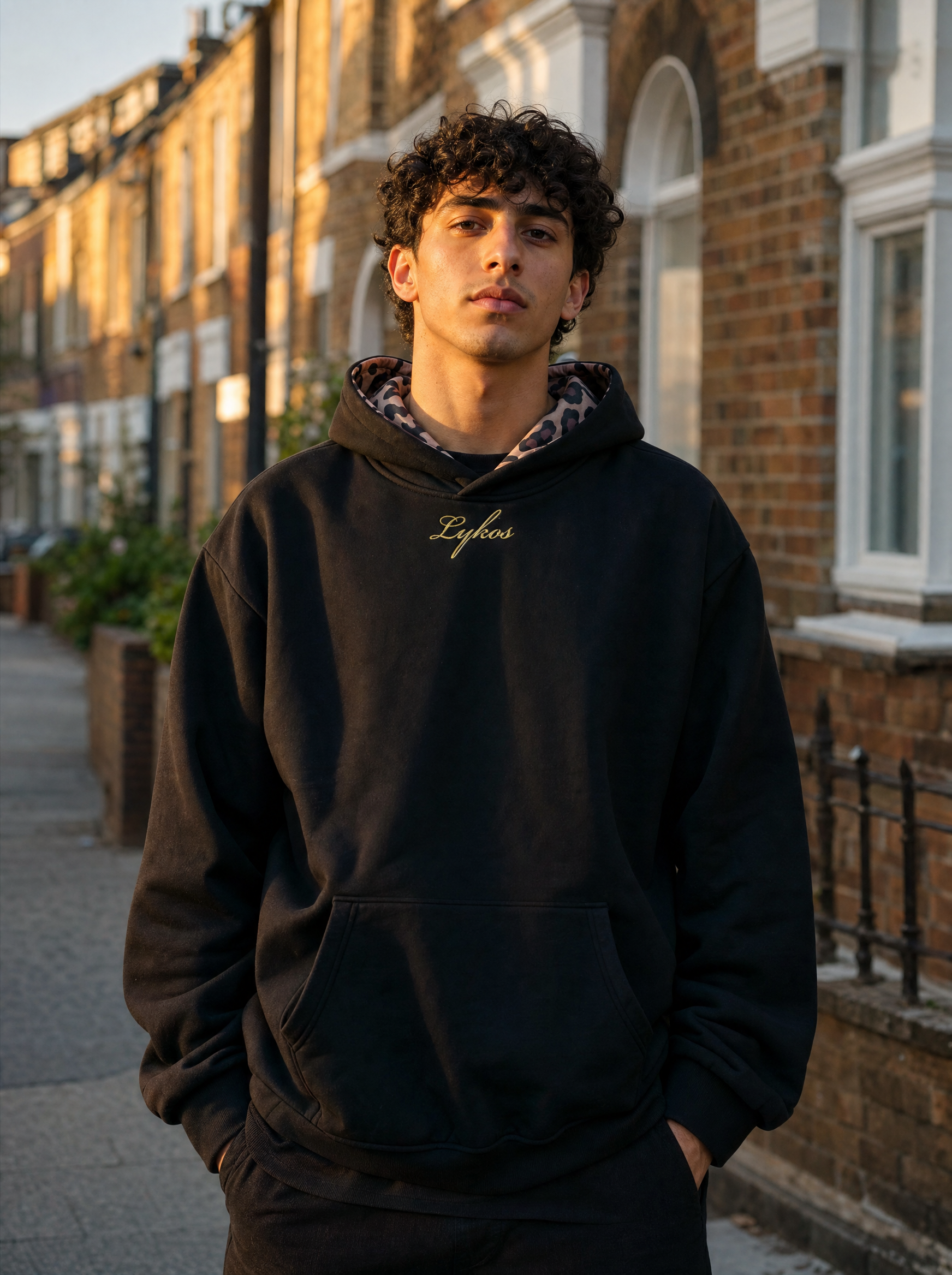 Origin Hoodie Black worn on a London street at golden hour